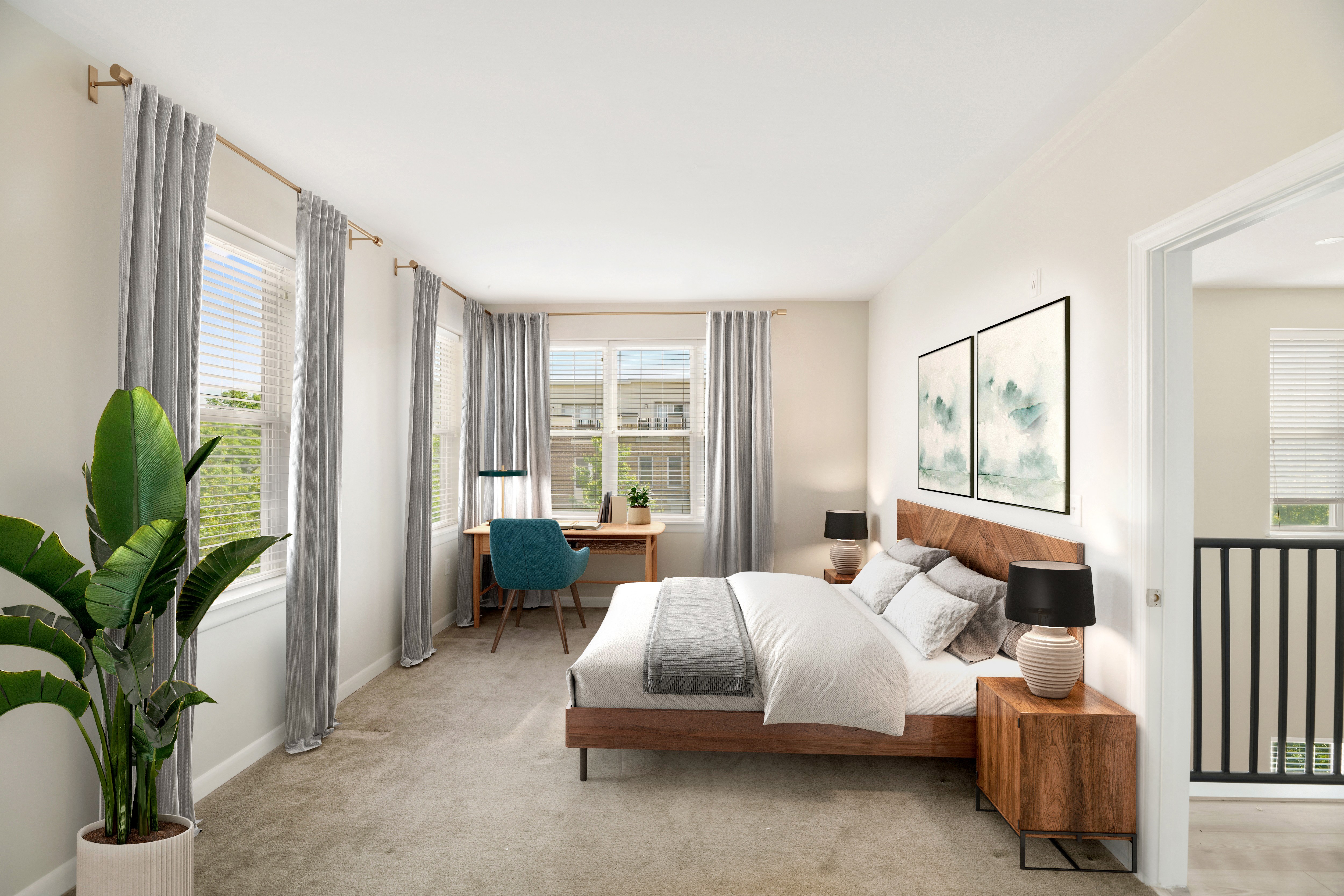 a bedroom with a bed and a desk with a chair